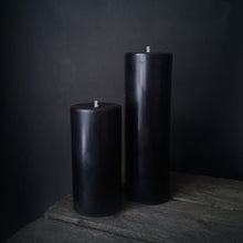 Load image into Gallery viewer, A small and medium Rustic Beeswax Pillar Black candles on a wooden box
