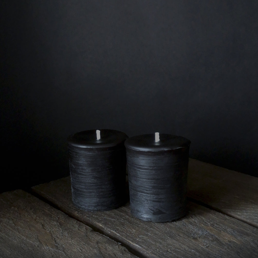 A pair of Black Rustic Votive candles